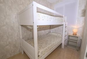 Postel nebo postele na pokoji v ubytování Edificio Arenal