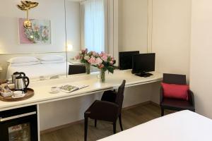 Televízia a/alebo spoločenská miestnosť v ubytovaní Starhotels Cristallo Palace