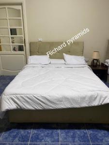 Krevet ili kreveti u jedinici u objektu Richard Pyramids inn hotel