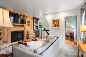 a living room with a couch and a fireplace at Private Home Great Location Dog Friendly in Provincetown
