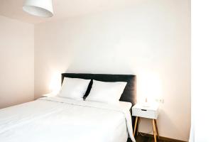 Łóżko lub łóżka w pokoju w obiekcie Family Suite