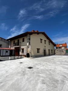 a building with a lot of snow in front of it at Casa ROSAMUNDA con gran jardín y cerca del mar in Santander