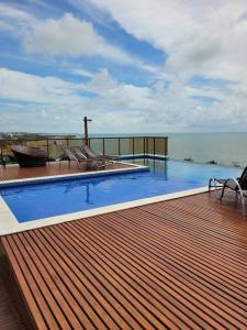 a swimming pool on top of a house with the ocean at Sol morena 1 in Conde