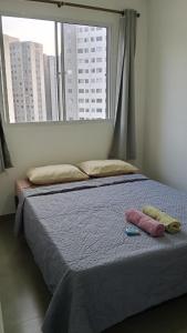 Ένα ή περισσότερα κρεβάτια σε δωμάτιο στο Apartamento Simba Safári, São Paulo Expo