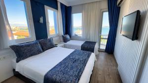 Giường trong phòng chung tại Ezer Hotel