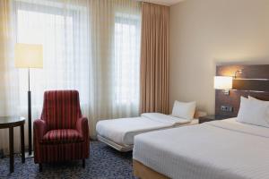 Giường trong phòng chung tại Courtyard by Marriott Vienna Prater/Messe