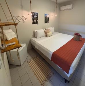 a bedroom with a large bed in a room at Hotel Rainha do Sertão By Lmm in Quixadá