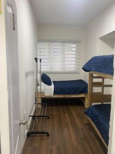 Postel nebo postele na pokoji v ubytování Hostal San Benito Chile