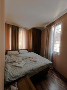 Ένα ή περισσότερα κρεβάτια σε δωμάτιο στο Sioni 2