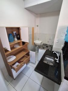 a small bathroom with a toilet and a sink at Apartamento Premium Grand Luxo in Fortaleza