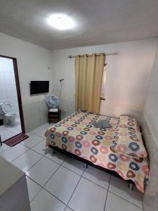 a bedroom with a bed and a television in it at Apartamento Premium Grand Luxo in Fortaleza