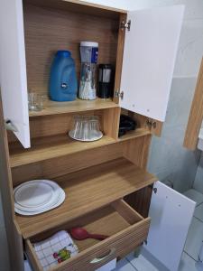 a cupboard with a toilet in a bathroom at Apartamento Premium Grand Luxo in Fortaleza