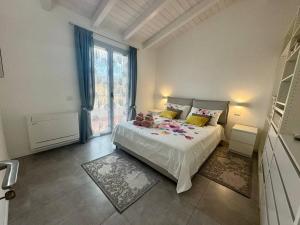a bedroom with a bed and a large window at Olimpia house, Quartucciu, South Sardinia, IUNT1079 in Quartucciu