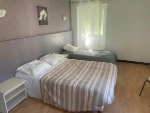 Postel nebo postele na pokoji v ubytování le bistrot ardéchois by Papytof