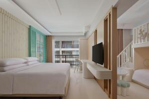 Postel nebo postele na pokoji v ubytování Four Points by Sheraton Bali, Kuta