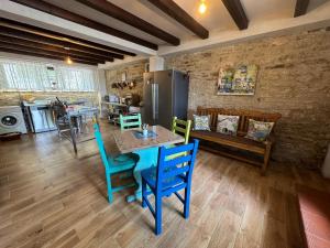 a kitchen and dining room with a table and chairs at Зоя от 1903 in Kavarna