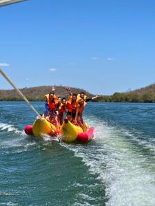 a group of people on a raft in the water at Aconchego Matuto - Hotel Club e Restaurante in Canindé de São Francisco +3 photos
