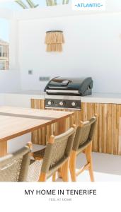 Una representación de una oficina en casa con una impresora. en -ATLANTIC- by myhomeintenerife, Luxury Private heated pool, en Palm-mar