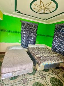 Postel nebo postele na pokoji v ubytování Hotel Henderson