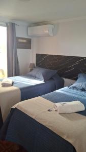 Postel nebo postele na pokoji v ubytování Habitaciones Barrancas