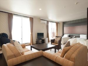 TV a/nebo společenská místnost v ubytování Cypress Resort Kumejima