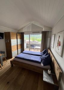 Postel nebo postele na pokoji v ubytování Studio Top im des Alpes