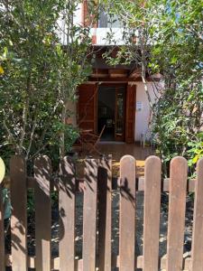 a wooden fence in front of a house at Villa Stintino in Stintino