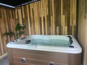 a jacuzzi tub in a wooden wall at Casitas de Madera O Loureiro in Noya +59 photos