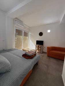 Ένα ή περισσότερα κρεβάτια σε δωμάτιο στο Restaurant & Apartments Lipa