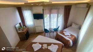 a small hotel room with a bed and a desk at Vento in Istanbul