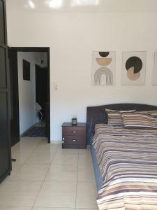 Posteľ alebo postele v izbe v ubytovaní Iris Room