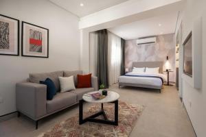 a living room with a couch and a bed at Exclusive savings at 22 by spacey #43 Studio in Maadi in Cairo +20 photos