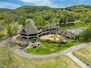 an aerial view of a large house with a driveway at Golf View Luxe at Stonebridge in Branson West