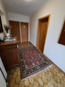 an empty room with a rug on the floor at Guesthouse Les Tilleuls in Fleurus