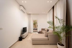 TV a/nebo společenská místnost v ubytování 77 by Spacey #63 - 1BR in Maadi
