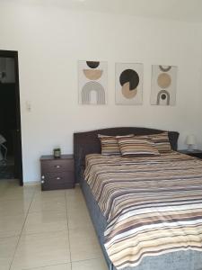 Posteľ alebo postele v izbe v ubytovaní Iris Room