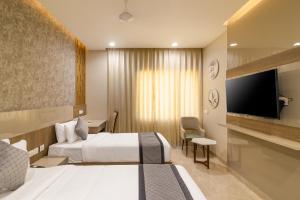 Rathna Residency客房内的一张或多张床位