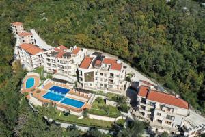 an aerial view of a house with a swimming pool at Adria Montenegro Apartment in Tušupi