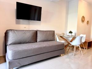 a living room with a couch and a table at Pachia Ammos Falasarna in Falasarna