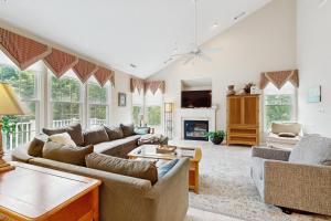 a living room with two couches and a fireplace at Bear Trap Dunes - 1D Clubhouse in Ocean View