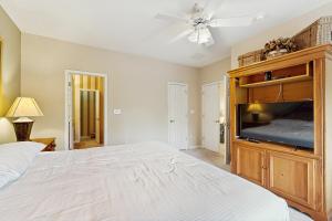 a bedroom with a bed and a ceiling fan at Bear Trap Dunes - 1D Clubhouse in Ocean View +34 photos