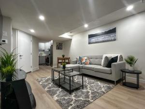 a living room with a couch and a table at Eli's Place in Calgary