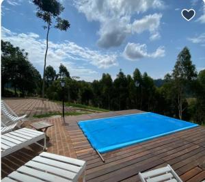 a swimming pool on the roof of a house at Casa de Fazenda Vale da Forquilha in Jacutinga