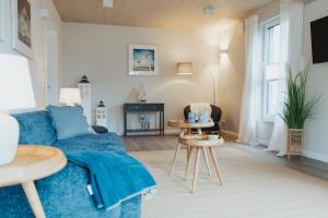 Et tv og/eller underholdning på NEU "Rügen Resørt Sagard" großzügiges, gemütliches Familienhaus "Lykke" mit Terrasse