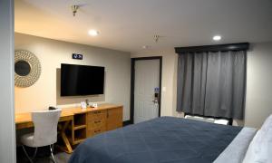 Postel nebo postele na pokoji v ubytování Carrier Motor Lodge
