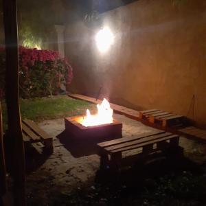 a fire pit in a yard at night at Villa Lunahuaná in Lunahuaná