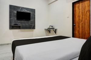 Postel nebo postele na pokoji v ubytování Hotel O Esta Inn