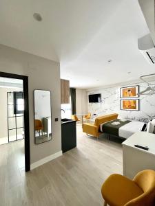 Ένα ή περισσότερα κρεβάτια σε δωμάτιο στο Apartamentos Élite - Art Collection - Gustav