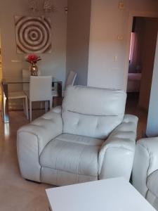 a living room with a couch and a table at Estrelicia IV in Marbella +25 photos