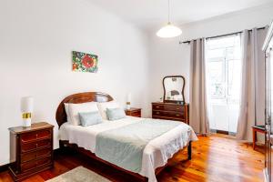 Ένα ή περισσότερα κρεβάτια σε δωμάτιο στο Garden View Apartment